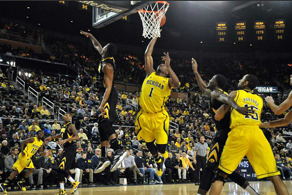 Derrick Walton Jr. (10), Glenn Robinson III (1), and Jon Horford (15)