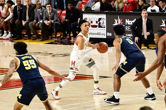 Eli Brooks (55), David DeJulius (0), and Zavier Simpson (3)