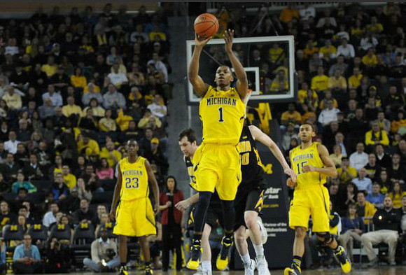 Caris LeVert (23), Glenn Robinson III (1), and Jon Horford (15)