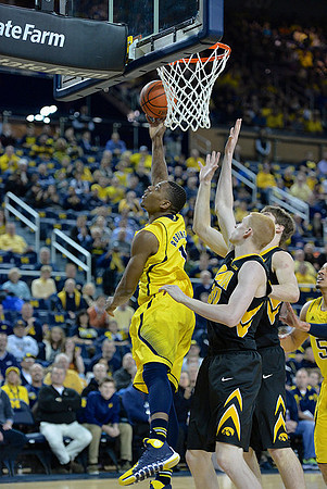 Glenn Robinson III (1) and Jordan Morgan (52)