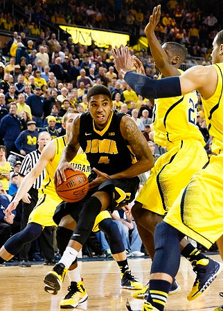 Nik Stauskas (11), Caris LeVert (23), and Jordan Morgan (52)