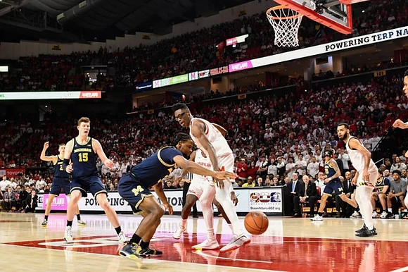 Franz Wagner (21), Jon Teske (15), Zavier Simpson (3), and Eli Brooks (55)