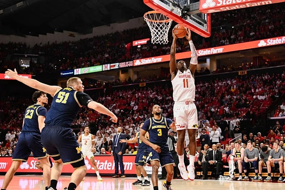 Brandon Johns Jr. (23), Austin Davis (51), David DeJulius (0), Zavier Simpson (3), and Juwan Howard
