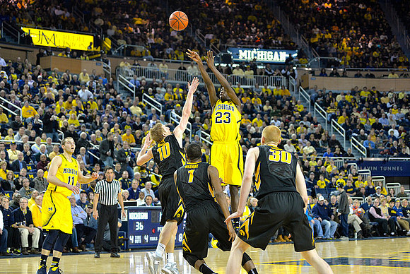 Nik Stauskas (11) and Caris LeVert (23)