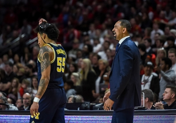 Eli Brooks (55) and Juwan Howard