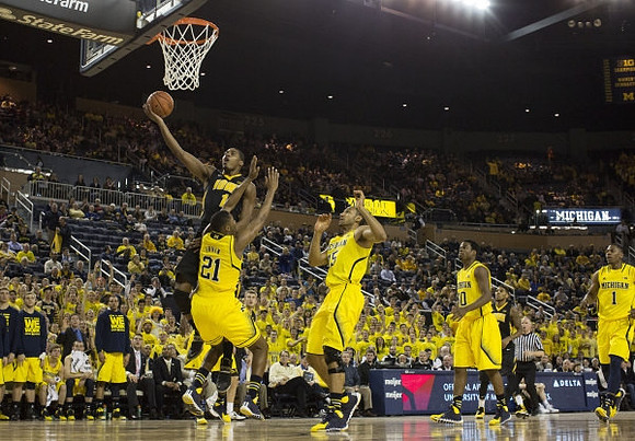 Zak Irvin (21), Jon Horford (15), Derrick Walton Jr. (10), and Glenn Robinson III (1)