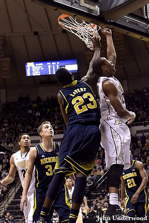 Mark Donnal (34), Caris LeVert (23), and Zak Irvin (21)