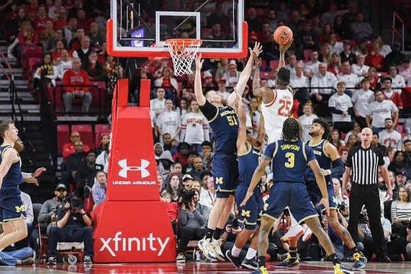 Franz Wagner (21), Austin Davis (51), David DeJulius (0), Zavier Simpson (3), and Isaiah Livers (2)
