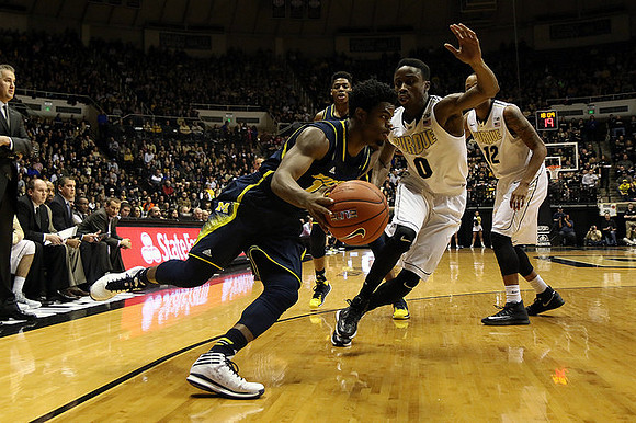 Derrick Walton Jr. (10), Kameron Chatman (3), and Purdue Head Head Coach Matt Painter