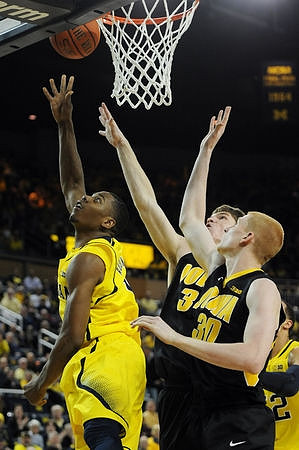 Glenn Robinson III (1) and Jordan Morgan (52)