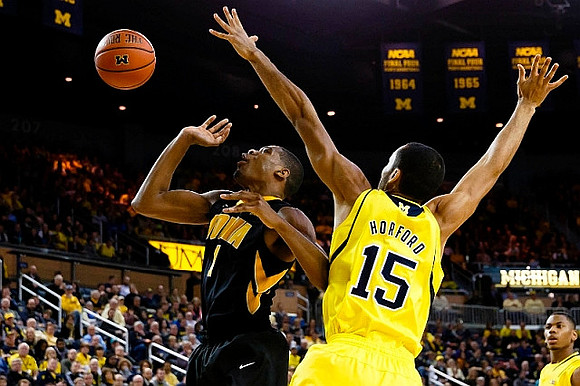 Jon Horford (15) and Glenn Robinson III (1)