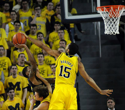 Jon Horford (15) and Spike Albrecht (2)