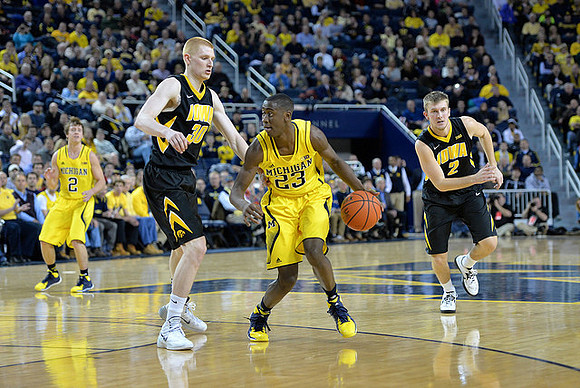 Spike Albrecht (2) and Caris LeVert (23)