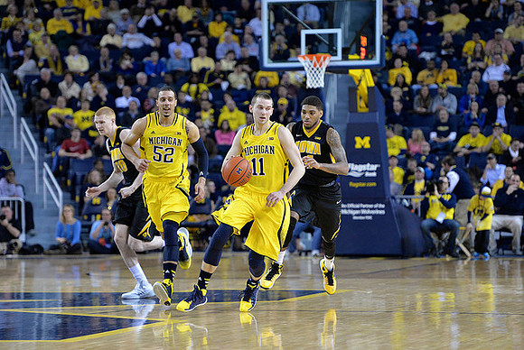 Jordan Morgan (52) and Nik Stauskas (11)