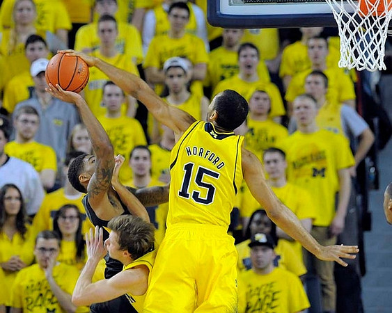 Spike Albrecht (2) and Jon Horford (15)