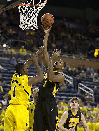 Glenn Robinson III (1) and Jordan Morgan (52)