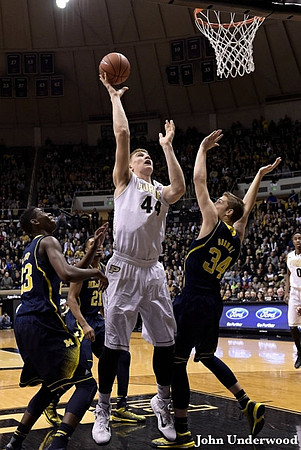 Caris LeVert (23), Zak Irvin (21), and Mark Donnal (34)