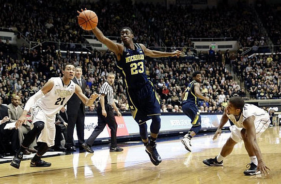 Caris LeVert (23), Derrick Walton Jr. (10), and Purdue Head Head Coach Matt Painter