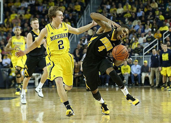 Spike Albrecht (2) and Jon Horford (15)