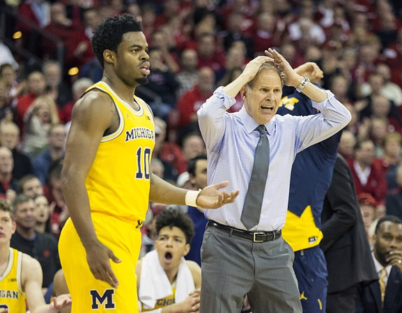 Derrick Walton Jr. (10) and John Beilein