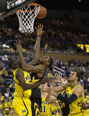 Caris LeVert (23), Nik Stauskas (11), and Jordan Morgan (52)