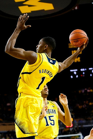 Glenn Robinson III (1) and Jon Horford (15)