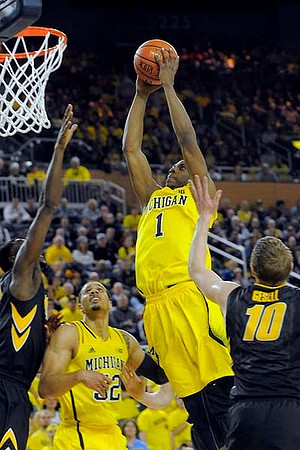 Glenn Robinson III (1) and Jordan Morgan (52)