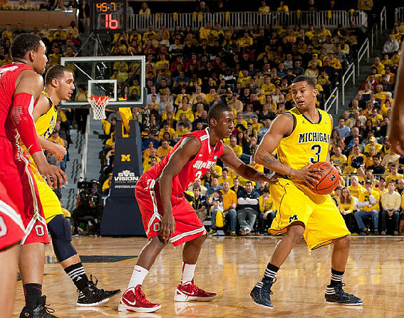 Jordan Morgan (52) and Trey Burke (3)