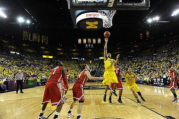 Trey Burke (3) and Jordan Morgan (52)