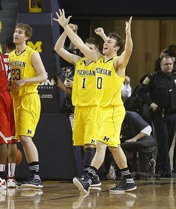 Evan Smotrycz (23), Stu Douglass (1), and Zack Novak (0)