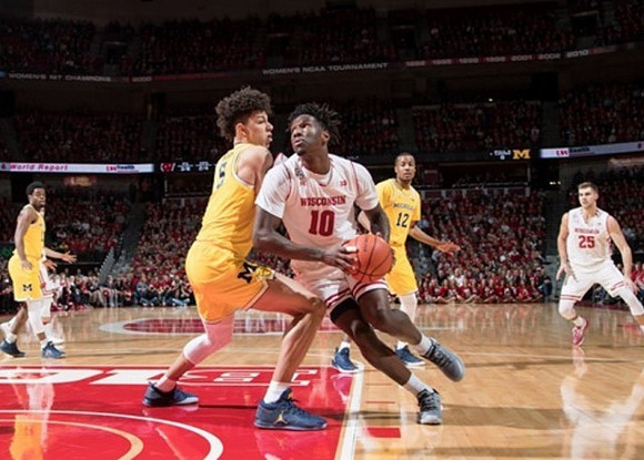 Derrick Walton Jr. (10), D.J. Wilson (5), and Muhammad-Ali Abdur-Rahkman (12)