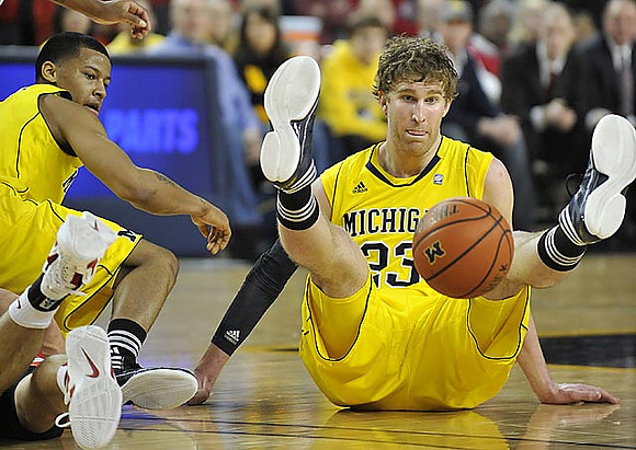 Trey Burke (3) and Evan Smotrycz (23)