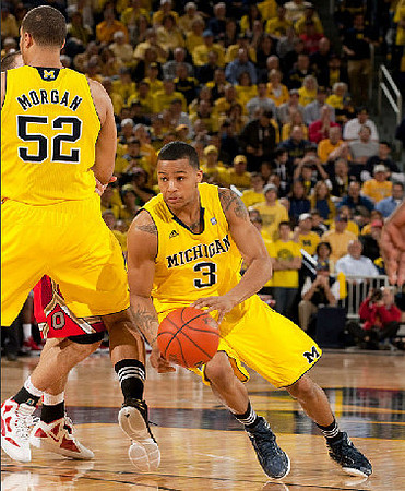 Jordan Morgan (52) and Trey Burke (3)