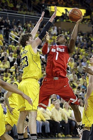 Trey Burke (3), Evan Smotrycz (23), and Stu Douglass (1)