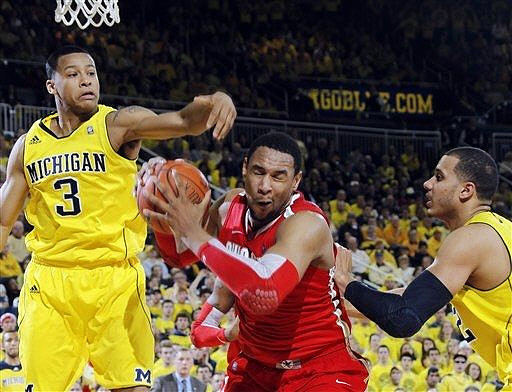 Trey Burke (3) and Jordan Morgan (52)