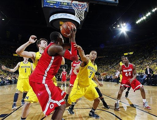 Stu Douglass (1), Zack Novak (0), Trey Burke (3), and Tim Hardaway Jr. (10)