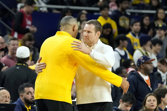Juwan Howard and Nebraska Head Coach Fred Hoiberg