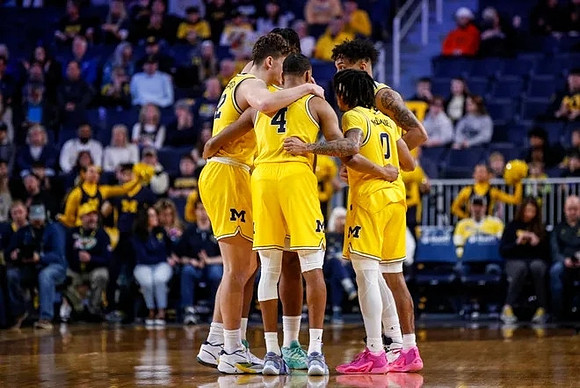 Will Tschetter (42), Tarris Reed Jr. (32), Nimari Burnett (4), Dug McDaniel (0), and Terrance Williams II (5)