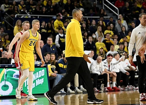 Youssef Khayat (24), Juwan Howard, and Nebraska Head Coach Fred Hoiberg