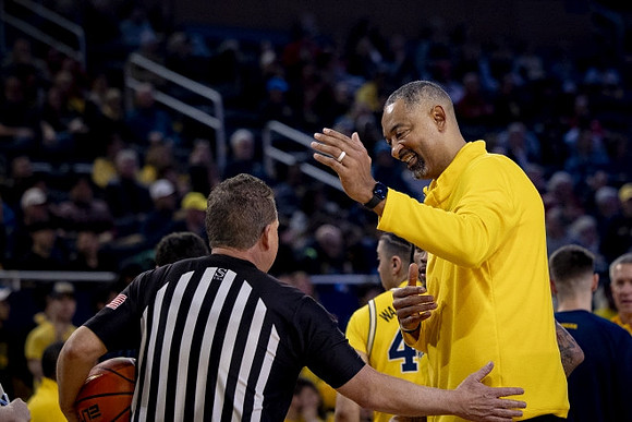 George Washington III (40) and Juwan Howard