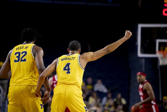 Tarris Reed Jr. (32) and Nimari Burnett (4)