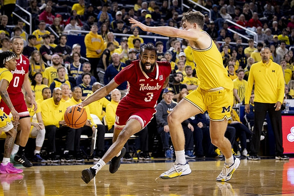 Dug McDaniel (0), Will Tschetter (42), and Juwan Howard