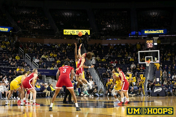 Will Tschetter (42), Tarris Reed Jr. (32), and Nimari Burnett (4)