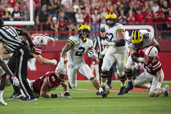 Blake Corum (2), Karsen Barnhart (52), and Andrew Vastardis (68)