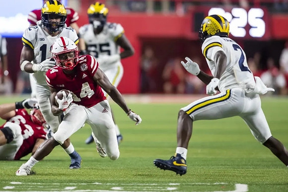 Josh Ross (12) and David Ojabo (55)