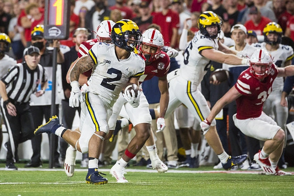 Blake Corum (2) and Luke Schoonmaker (86)