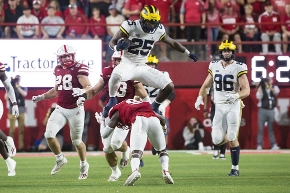 Hassan Haskins (25) and Luke Schoonmaker (86)