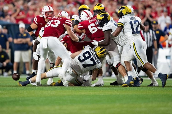 Aidan Hutchinson (97) and Josh Ross (12)