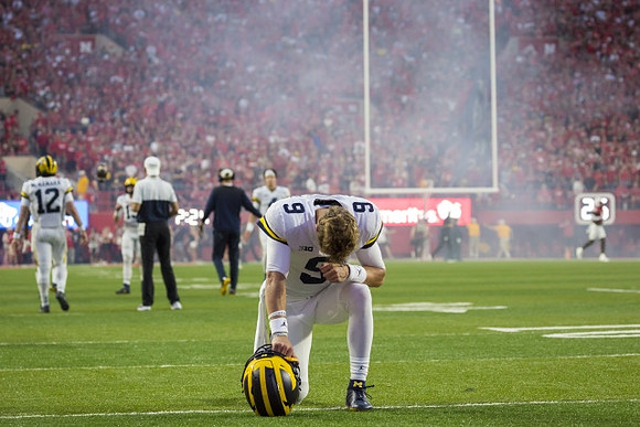 Cade McNamara (12) and J.J. McCarthy (9)
