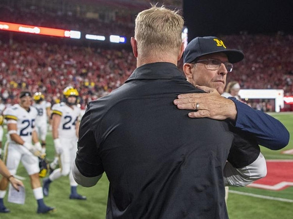 Nebraska Head Coach Scott Frost and Jim Harbaugh